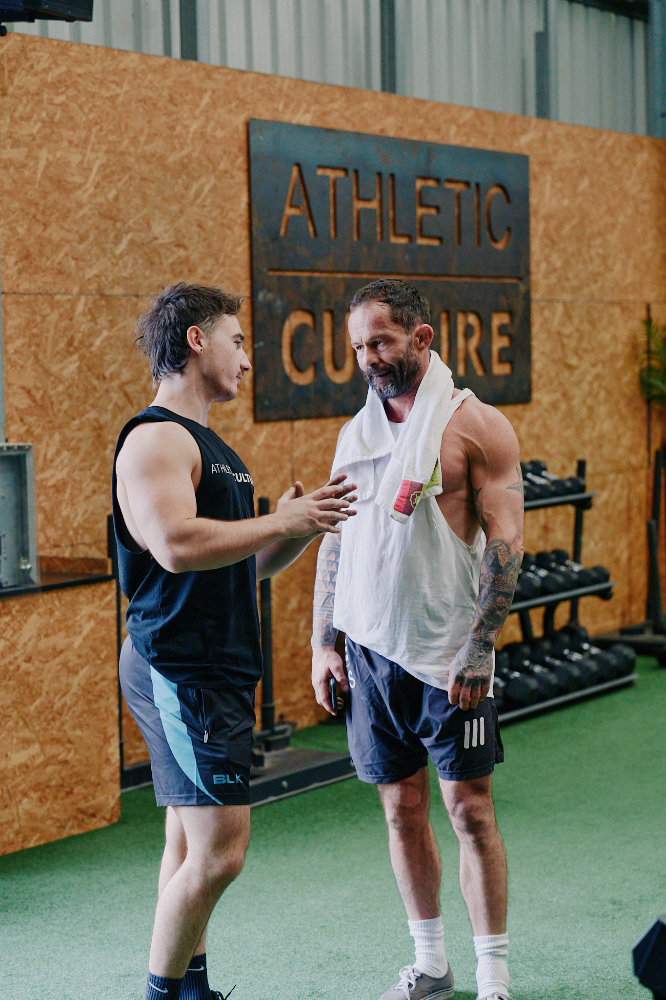 Daniel coaching a client in the gym